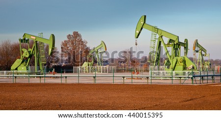 Group of European Oil Pump Jacks in Germany in a station on a Sunny Day
