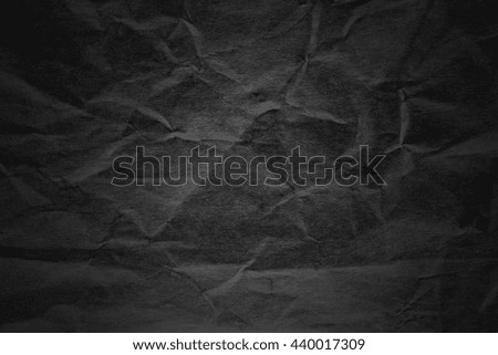Dark black paper with light texture background