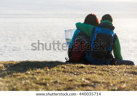 Tourist couple looking at water