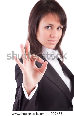 Business woman signaling ok - focus on finger