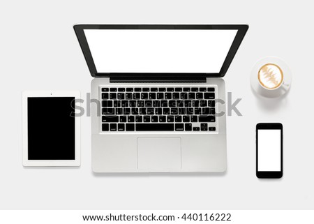 Mockup laptop, tablet, smartphone and coffee cup on white background. Copy space for text and logo. Clipping Path included on white background.