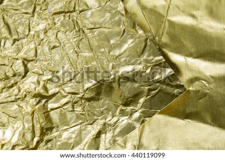 Golden foil surface textured background