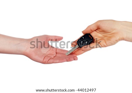 Hands holding an automobile key isolated on white