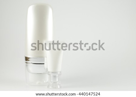 cosmetic tube , skin body cream product , facial cream container , medical plastic tube on grey background 