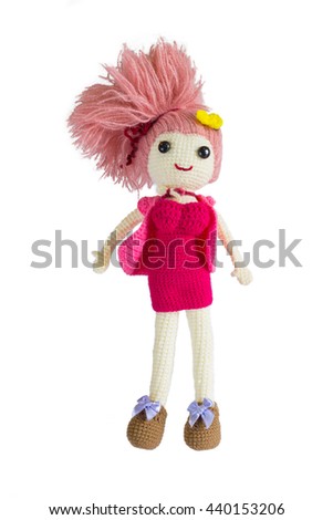 Lovely girl doll from crochet handmade on white background 