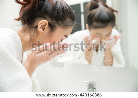 Woman wakes from sleep and she was cleansing the morning before shower Royalty-Free Stock Photo #440166886
