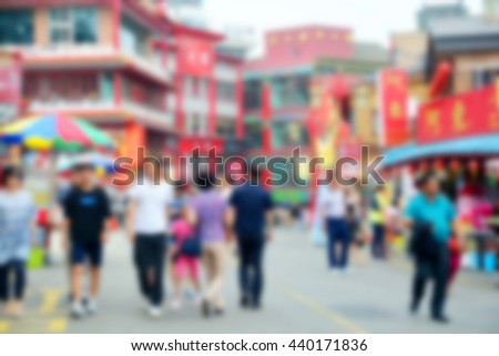 Abstract blurred image of people walking on the street in china town