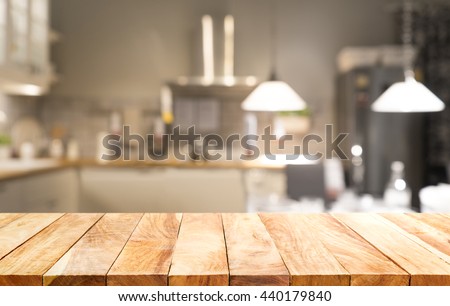 Wood table top on light abstract from kitchen room background .For montage product display or design key visual layout.