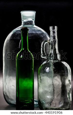 glass bottle, empty, original, on black background space for text