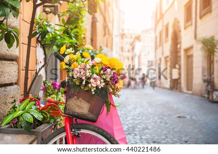 Bicycle with flowers in the old street in Rome, Italy Royalty-Free Stock Photo #440221486