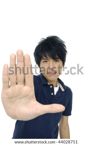 Asian young man making stop with his hand