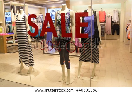 sale sign and showcase model at shop 