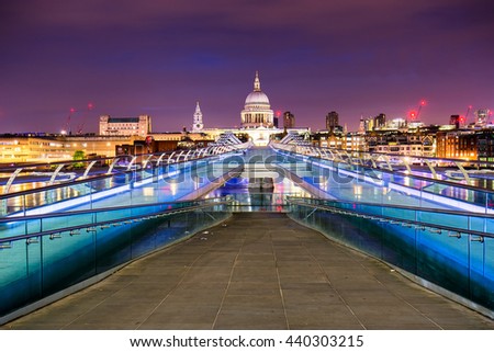 Millennium Bridge leads to Saint Paul's Cathedral in central London at night.