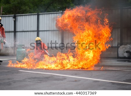 Firefighter fighting fire during training