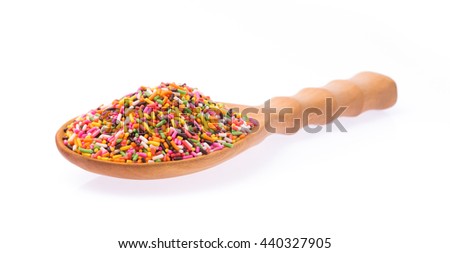 wood ladle of Color sprinkle sugar isolated on white background