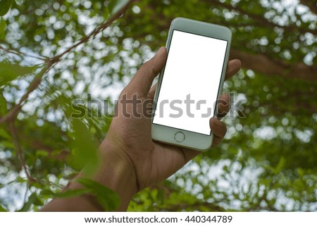 hand holding smartphone white background for text conserve nature . tree  background Ecology concept. World Environment Day concept