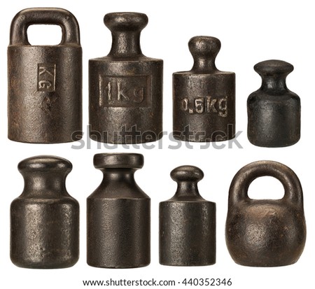 Old rusty iron scale weights isolated on white Royalty-Free Stock Photo #440352346