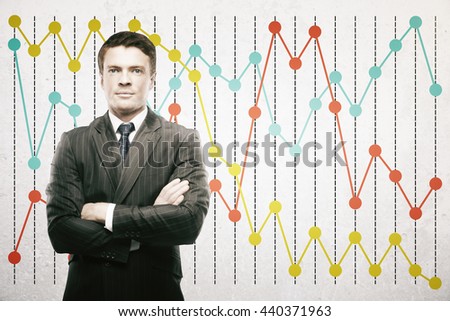 Confident businessman on colorful business chart background