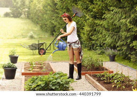 Picture of a young woman working in her garden