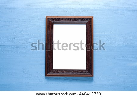 photo frame on wooden painted light blue rustic background