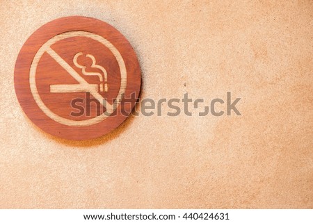 No smoking sign wood. Over the red grunge wall