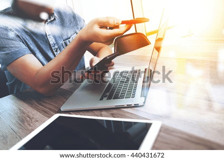 Businessman hand touching digital tablet.Photo finance manager working new Investment project office.Using new technology device.Strategy business stock exchanges interface layer effect
 
