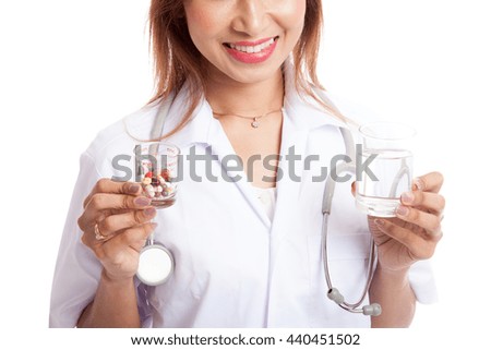 Young Asian female doctor with water and medicine  isolated on white background