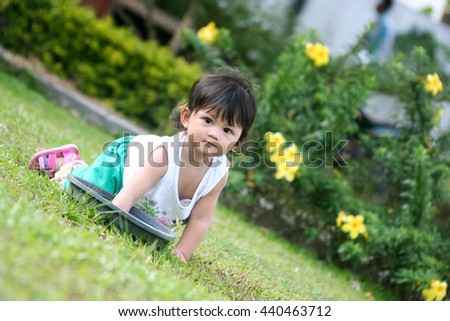 Girls playing in the lawn.
