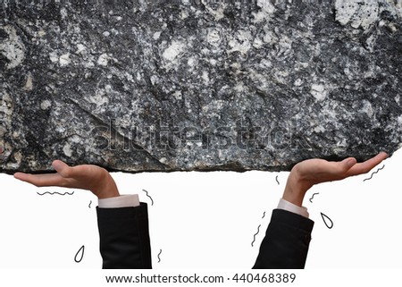 Business man hand carrying and making effort to push up big stone, metaphor to people carry problem or difficult situation.. Blank copyspace for your text or your design on stone texture. Royalty-Free Stock Photo #440468389