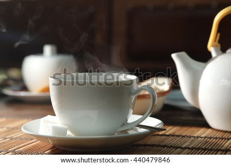 a cup of black tea and steam
