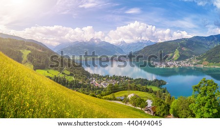 Beautiful panoramic view of the famous city of Zell am See with idyllic Zeller Lake and blooming meadows on a sunny spring day in Salzburg, Salzburger Land, Austria Royalty-Free Stock Photo #440494045