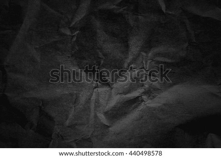 Dark paper creased with light texture background