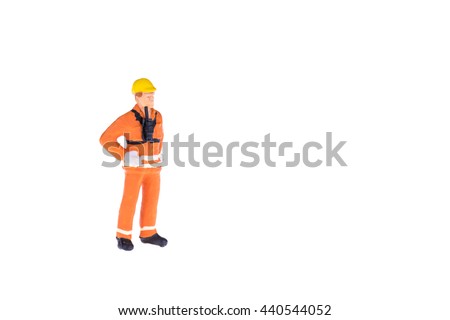 Close up of Miniature people in engineer and worker occupation isolate on white background.