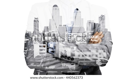 Portrait of Businessman in suit. Double exposure skyscraper on the background. Visual effects.