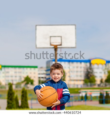 little boy playing basketball