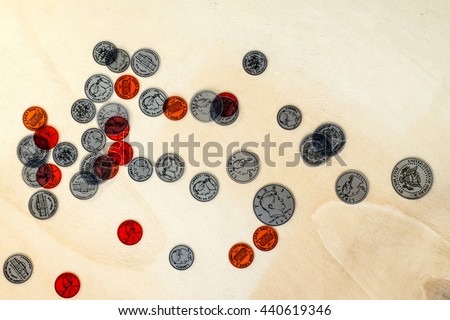 coins on a wooden floor
