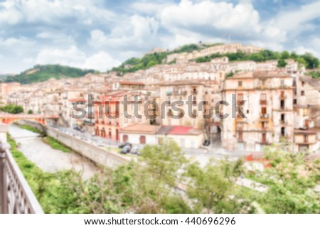 Defocused background with scenic aerial view of the Old Town with the Crathis River and historic buildings in Cosenza, Calabria, Italy. Intentionally blurred post production for bokeh effect