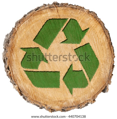 recycle symbol carved in wood tree sustainable energy green thinking earthy textured background rings age bark planet conscious recycled