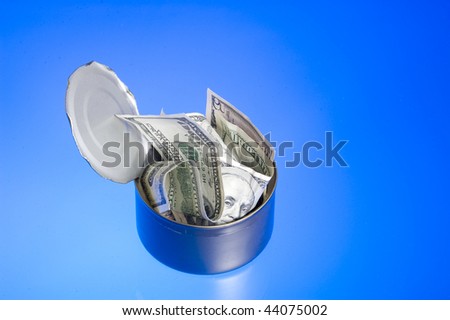 Jar of dollar isolated on blue.Business object