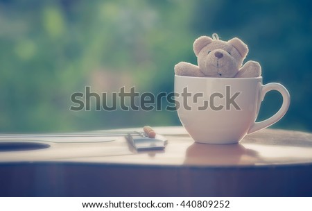 Bear in cup coffee on guitar vintage style