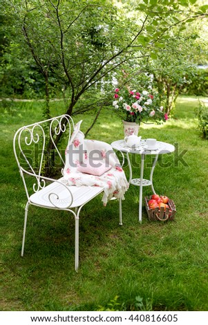 Summer garden with tea party setting. Outdoor party decorations