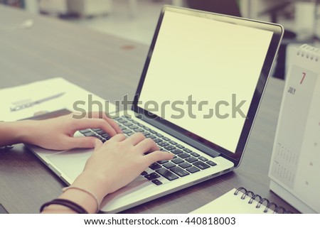 close up user employee woman hand working and typing at notebook in office room concept Royalty-Free Stock Photo #440818003