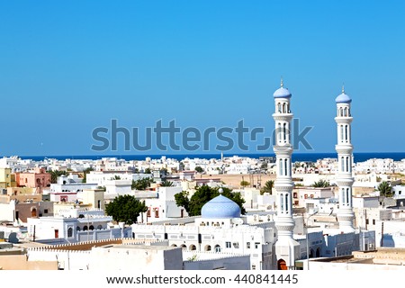  minaret and religion in clear sky in oman muscat the old mosque Royalty-Free Stock Photo #440841445