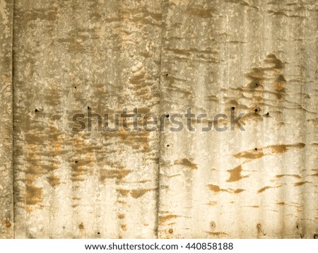 Close up image or texture of a corrugated roof sheet which has started to corrode