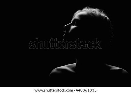 female profile on black background monochrome image with copyspace
