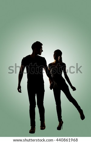 Silhouette of young Asian couple, full length portrait isolated.