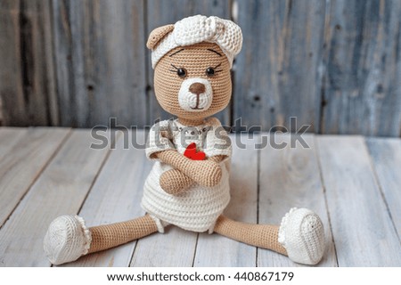 beautiful handmade toy bear in a white dress