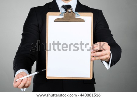 Businessman holding a clipboard