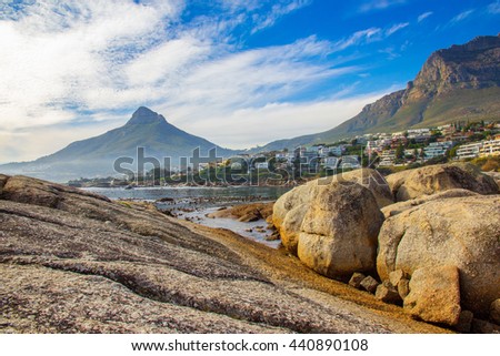A scenic landscape of the beautiful coast of Bakoven in Cape Town, South Africa with Lion's Head as the backdrop