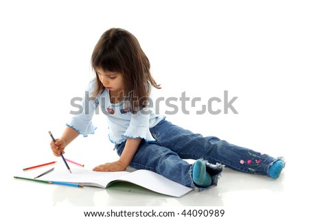 Little girl is drawing on white paper in album isolated